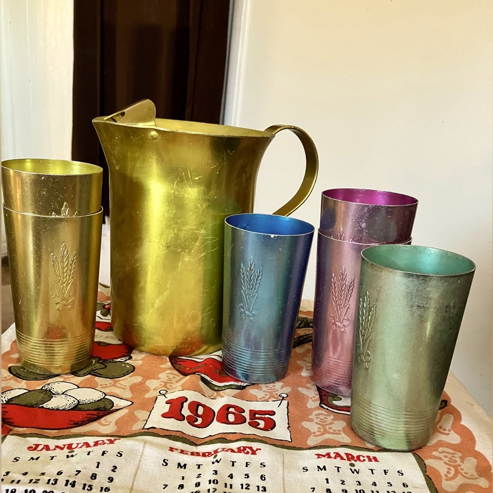 Vintage metal pitcher with 6 cups. West Bend multi colored set